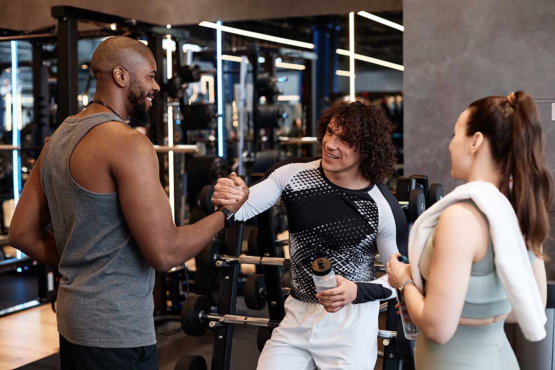 Group of People in Gym Shaking Hands